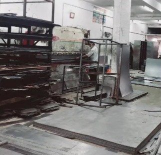 Steel work factory: steel sheets stacked on the shop floor